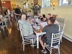 Guests enjoying a wine tasting outdoors