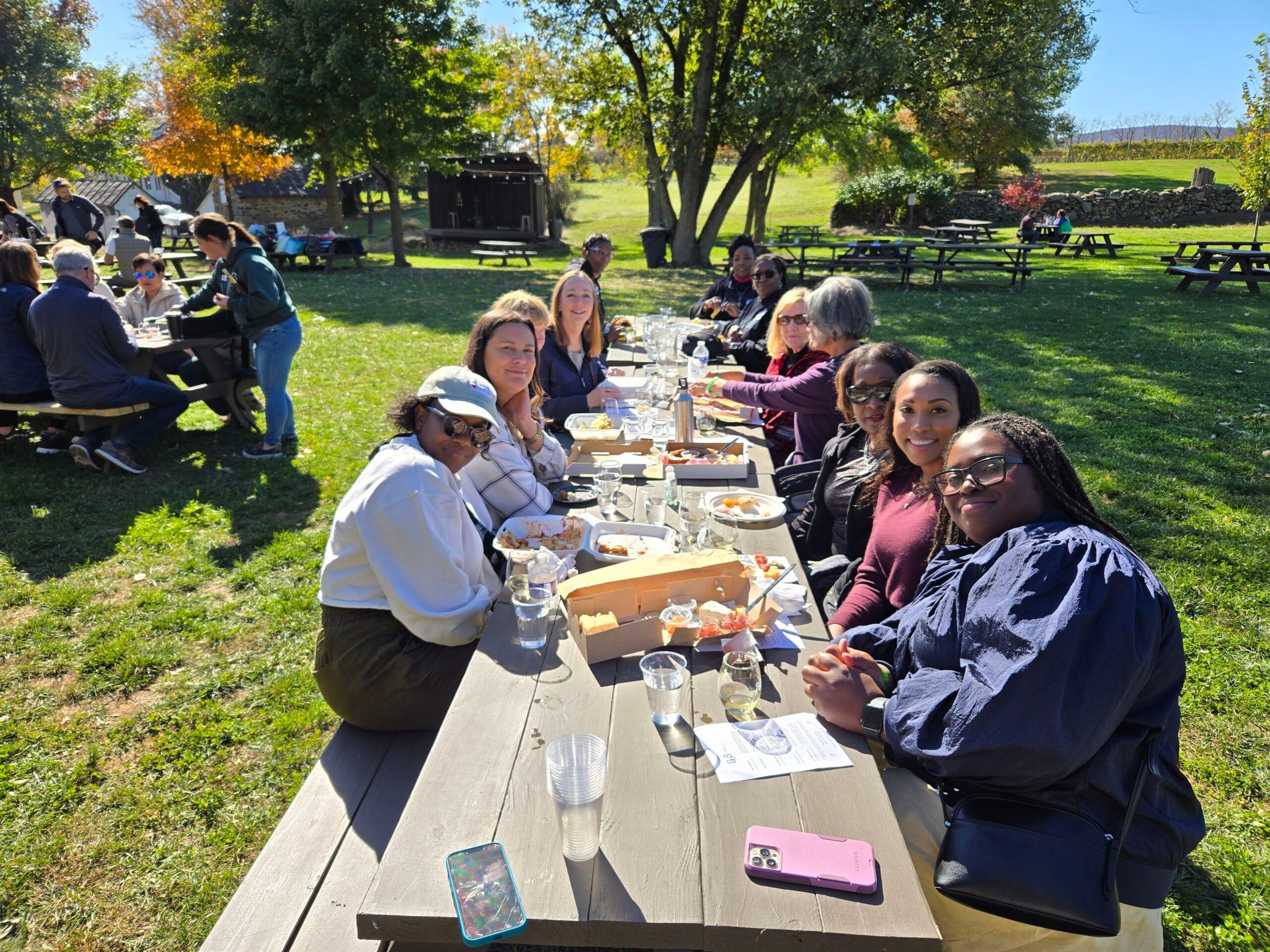 Vineyard Voyages guests seated outdoors at a Virginia winery