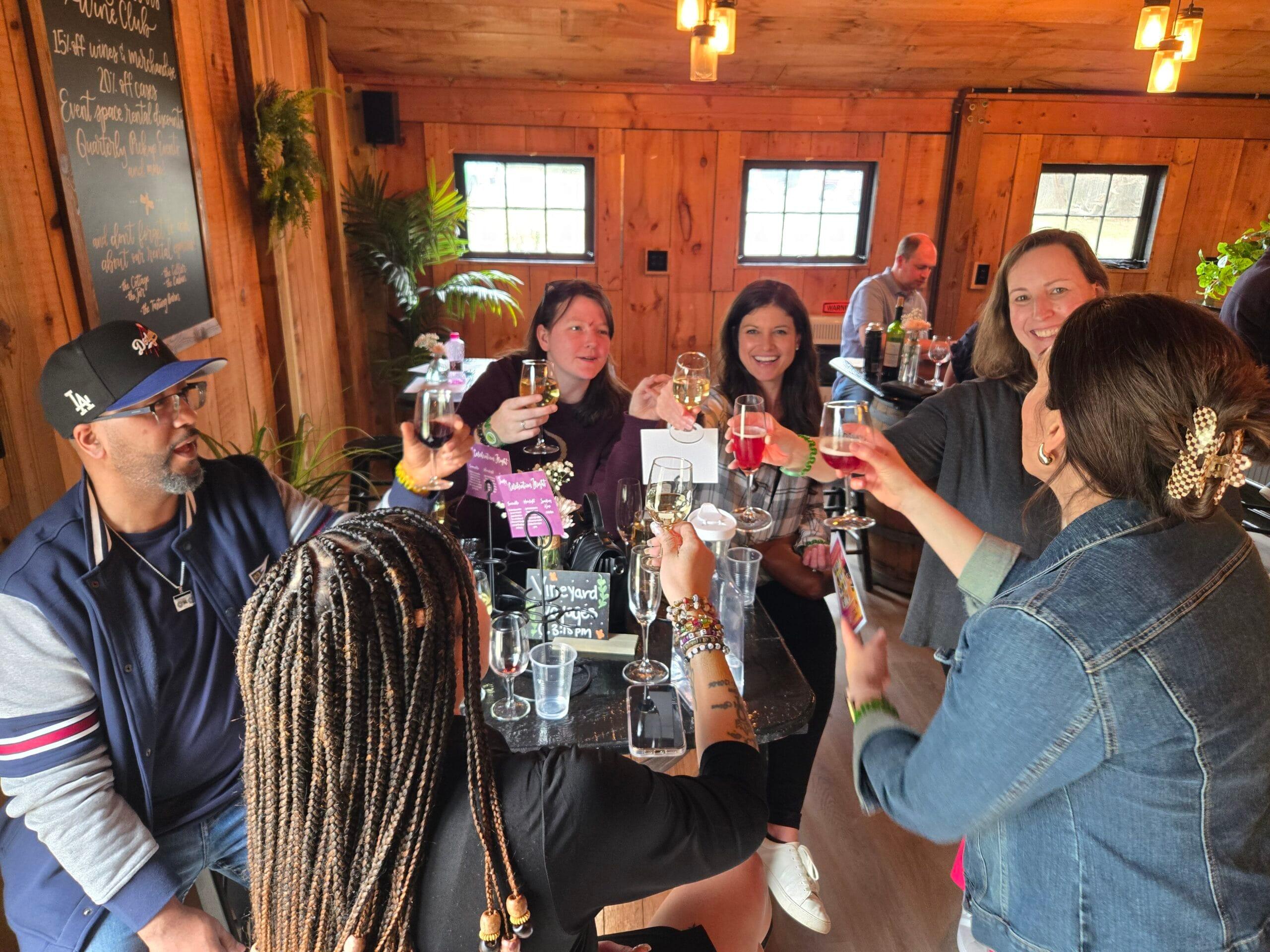Friends sharing wine and conversation during a private Vineyard Voyages outing