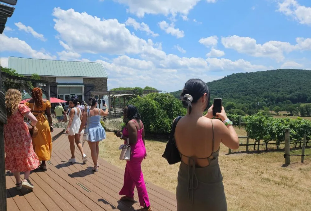 Guests walking toward a winery during a Vineyard Voyages corporate outing