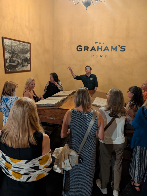 A Port wine educator speaking with Vineyard Voyages guests in Vila Nova de Gaia