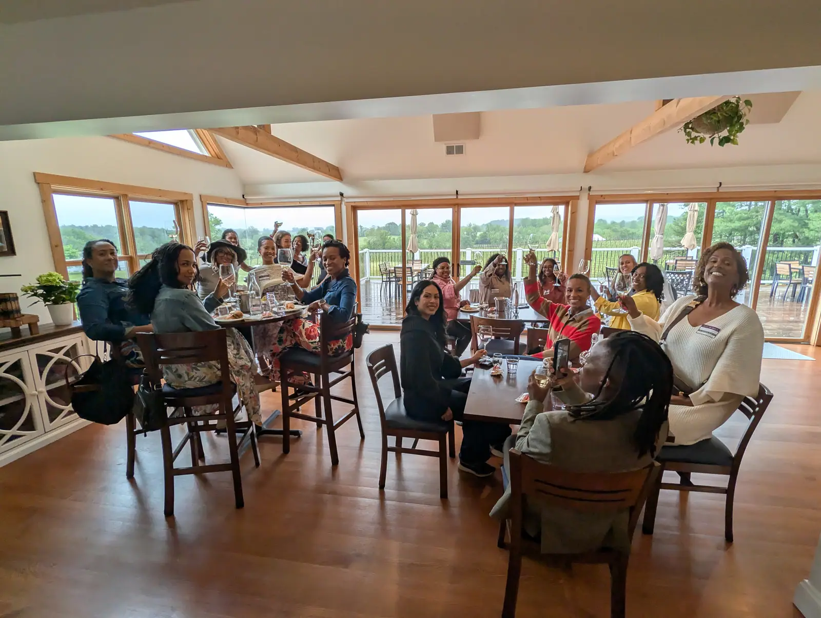 A club group spread across a winery tasting room