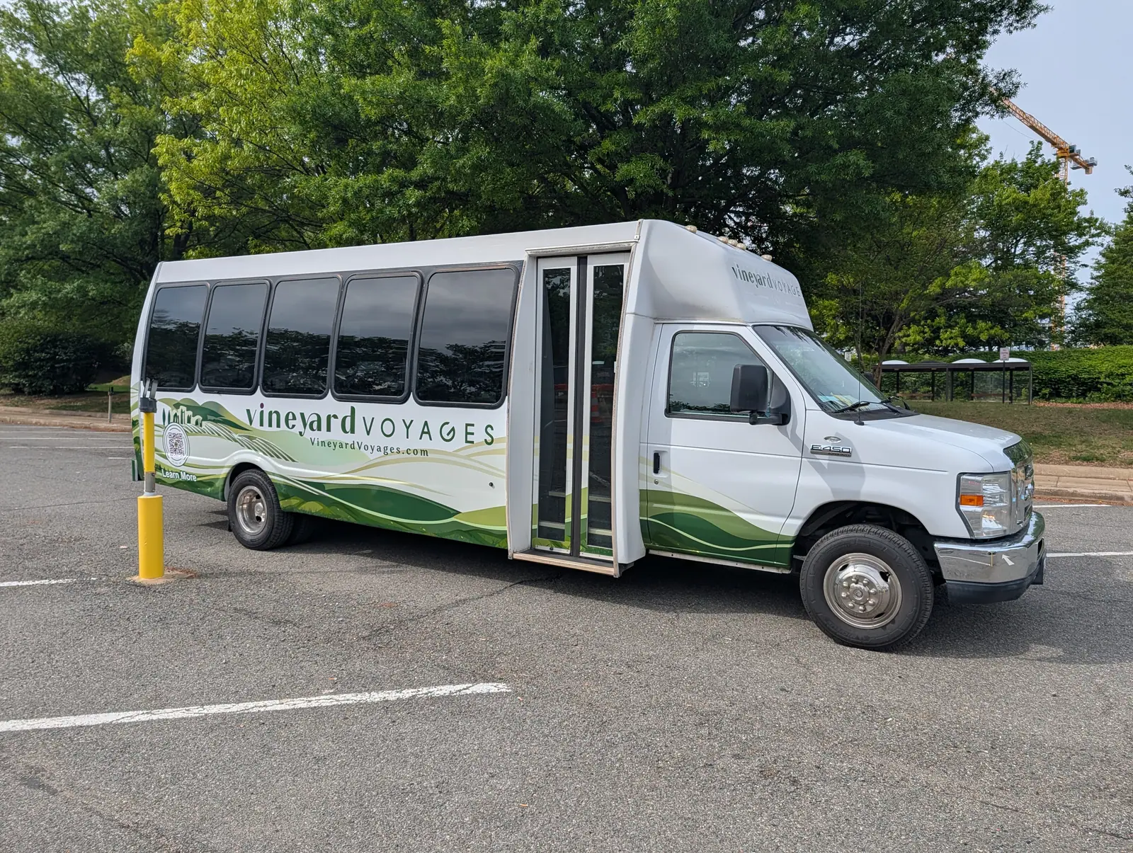 Side view of the 27-seat Vineyard Voyages executive bus