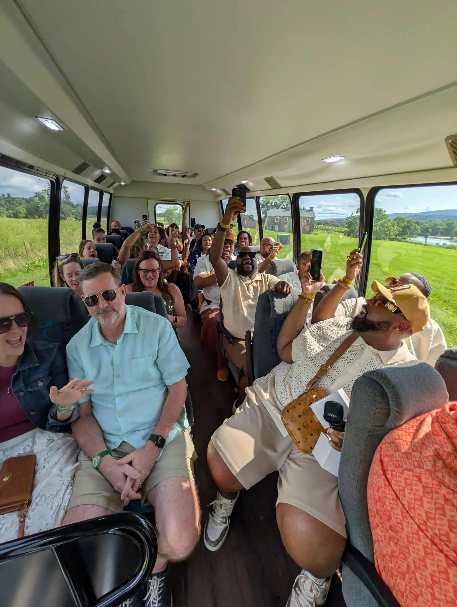 Guests seated on the Vineyard Voyages bus on the way to a winery