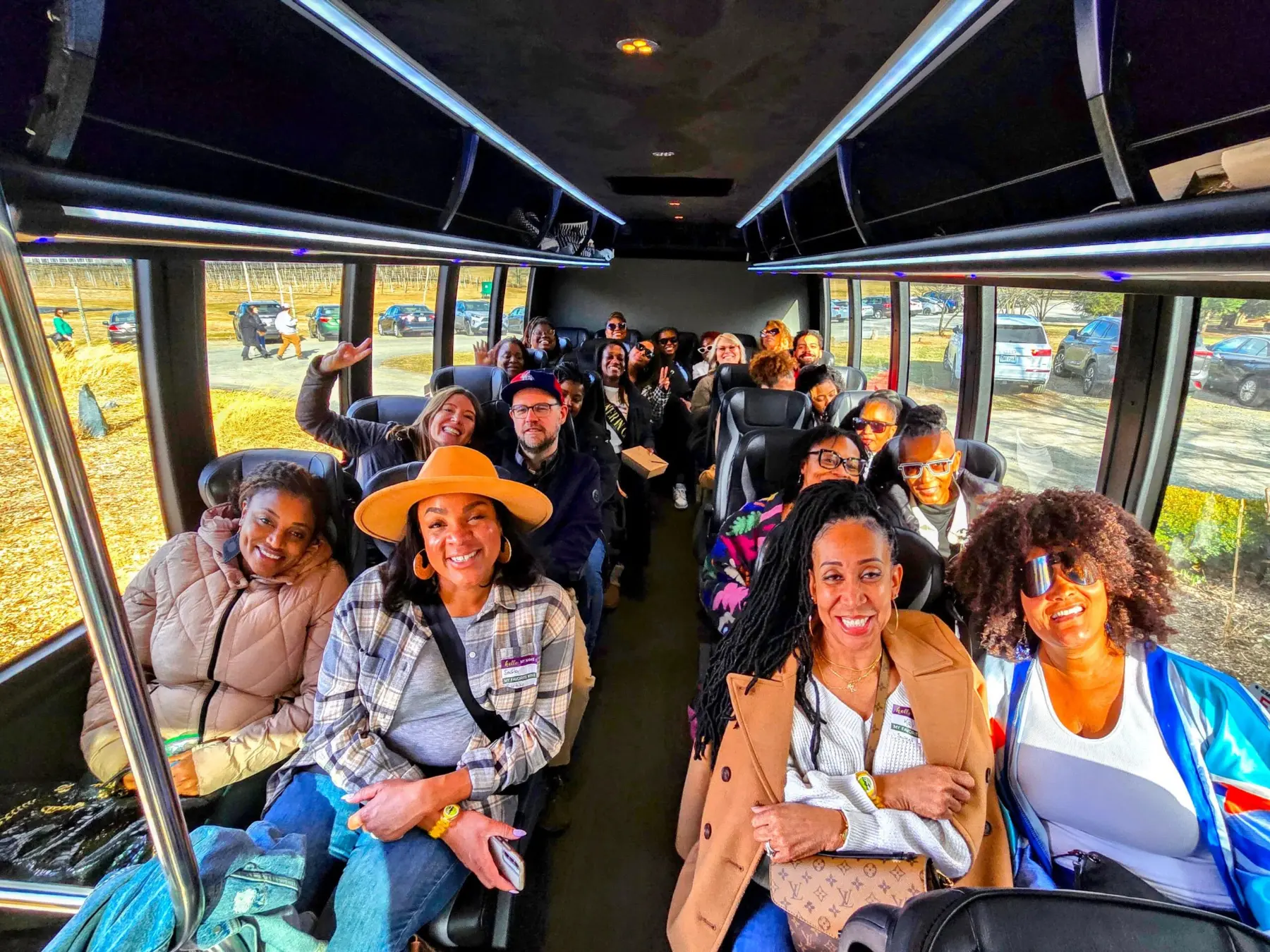 Guests traveling together inside an executive wine tour bus